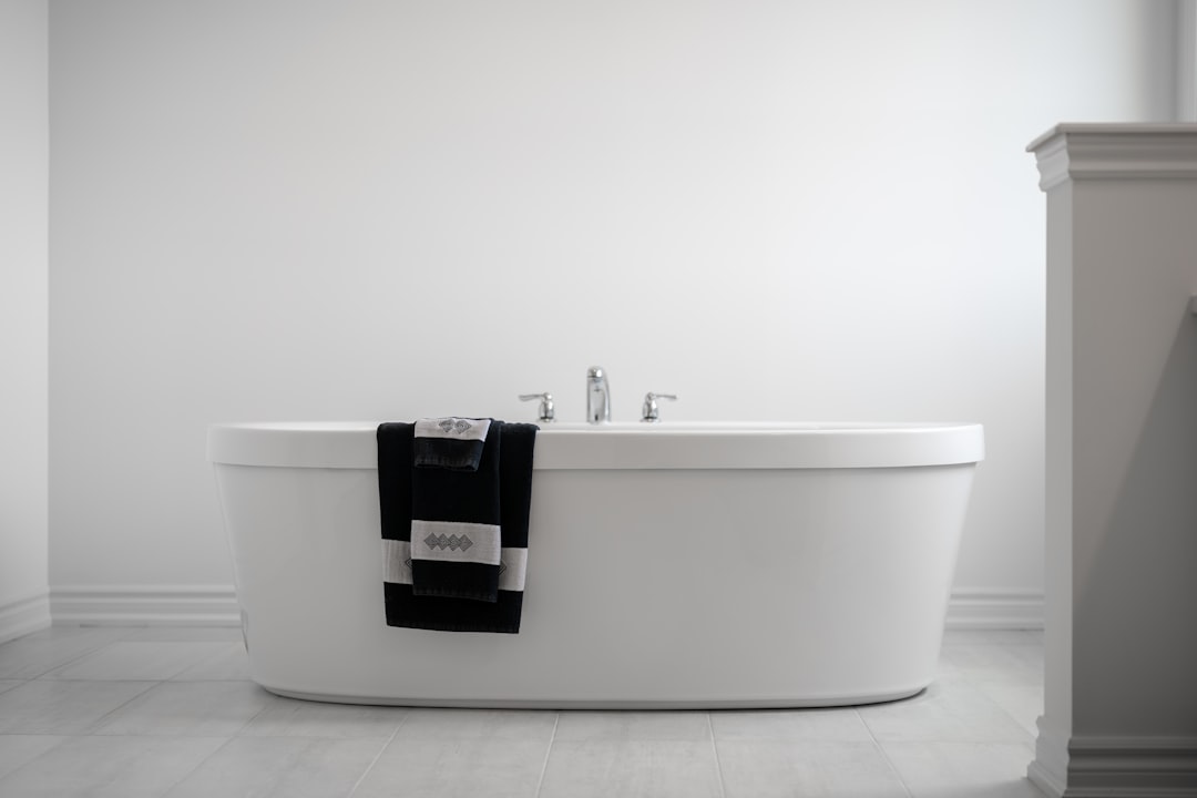 services-03 a-modern-bathtub-with-towels-draped-over-the-side-nderc229lpe